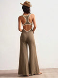 Taupe knit jumpsuit with open-back cutout and contrast trim