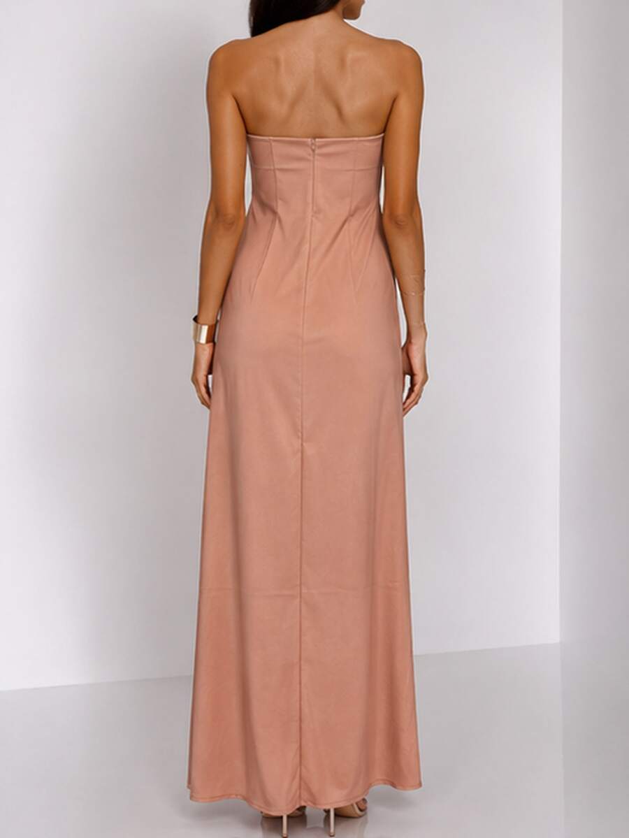 Front view of blush maxi dress with large orange floral print and strapless fitted bodice for summer events