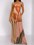 Three-quarter front view of lilac, black and cream abstract-print strapless maxi dress for parties