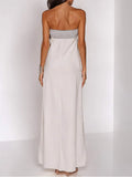 Three-quarter view of white and blush pink abstract-print strapless maxi dress with straight neckline for vacation