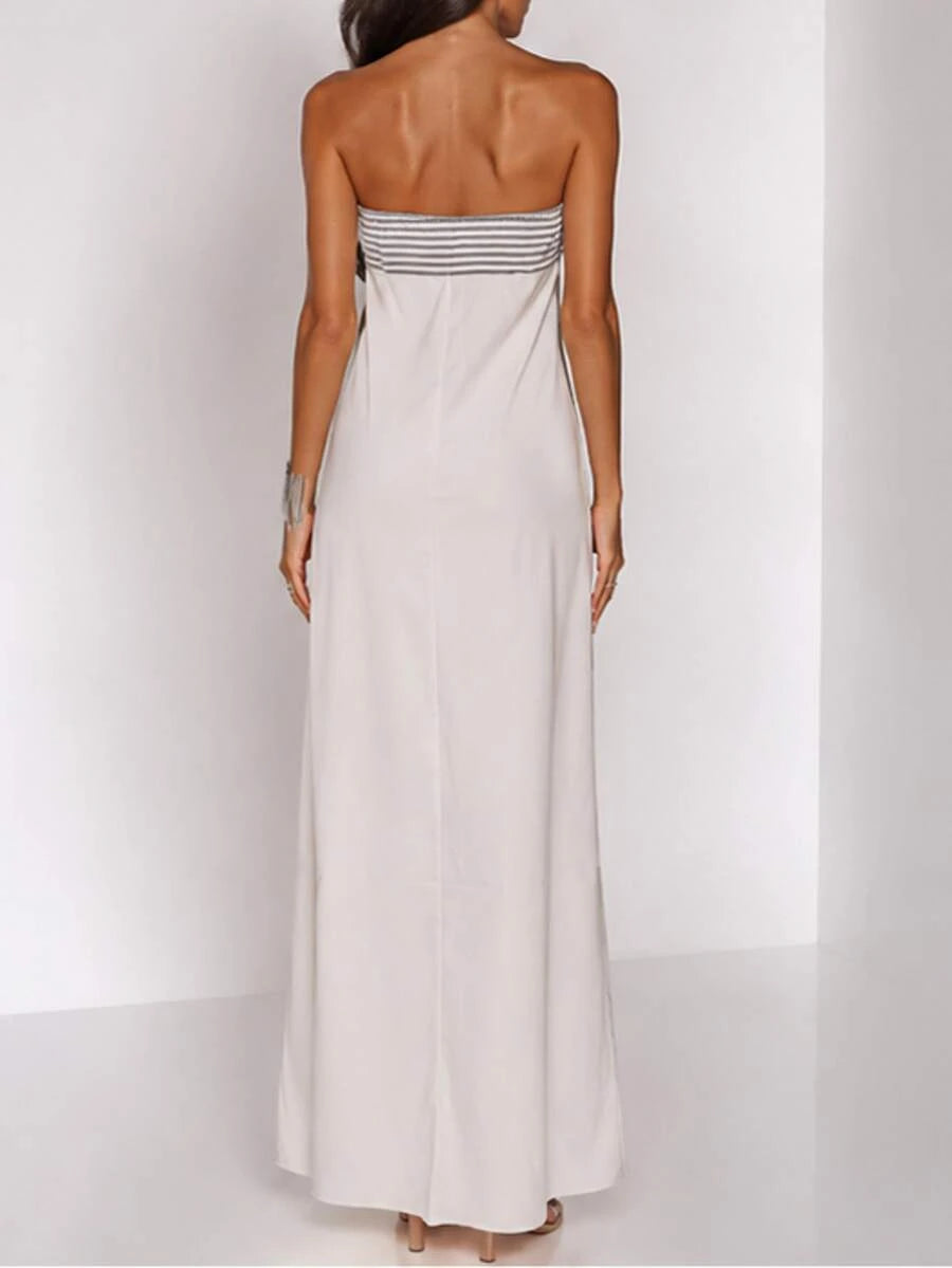 Three-quarter view of white and blush pink abstract-print strapless maxi dress with straight neckline for vacation