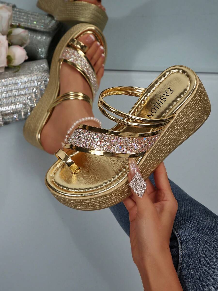 Gold platform wedge sandals with shiny straps and glitter cross band