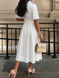 Back view of white short sleeve pleated midi dress