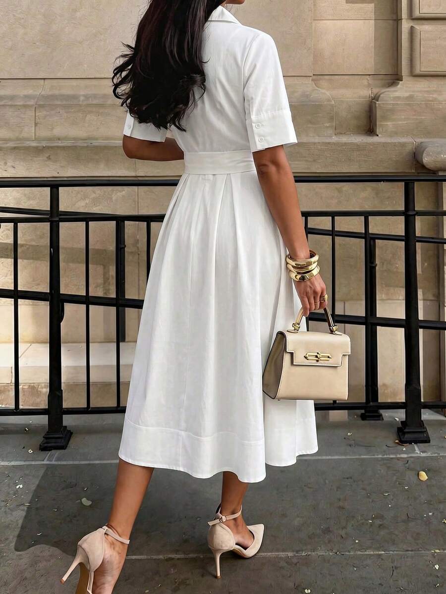 Back view of white short sleeve pleated midi dress