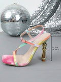 Side view of pastel strappy sandal showing 11.3 cm sculptural gold heel height