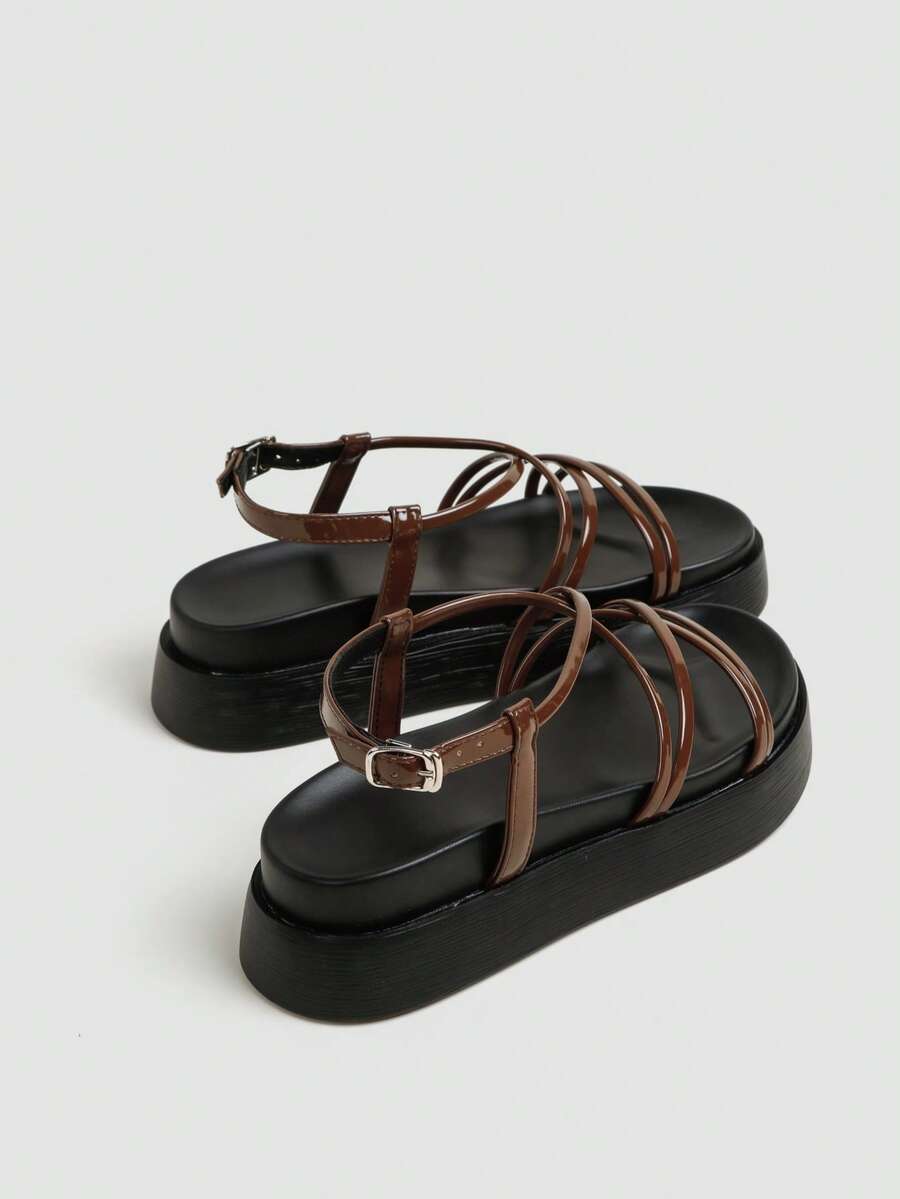 Brown slingback platform sandals rear side view showing ankle buckle and heel strap