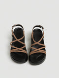 Tan platform sandals top view showing suede texture crossed straps and footbed