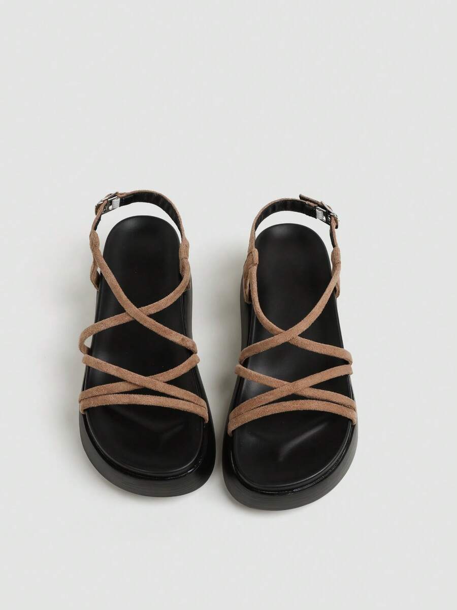 Tan platform sandals top view showing suede texture crossed straps and footbed