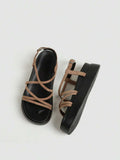 Tan slingback sandals outsole view showing textured black bottom and platform construction