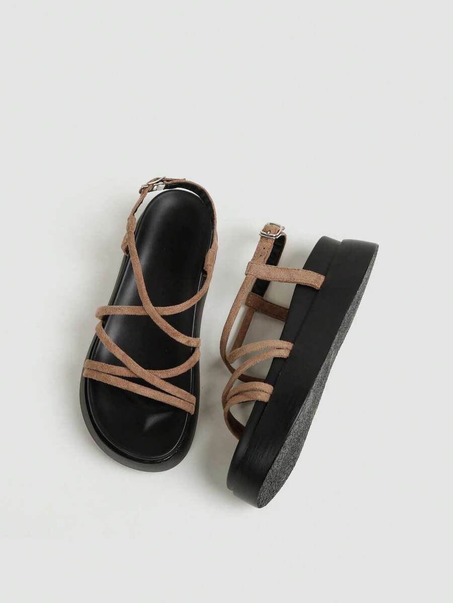 Tan slingback sandals outsole view showing textured black bottom and platform construction