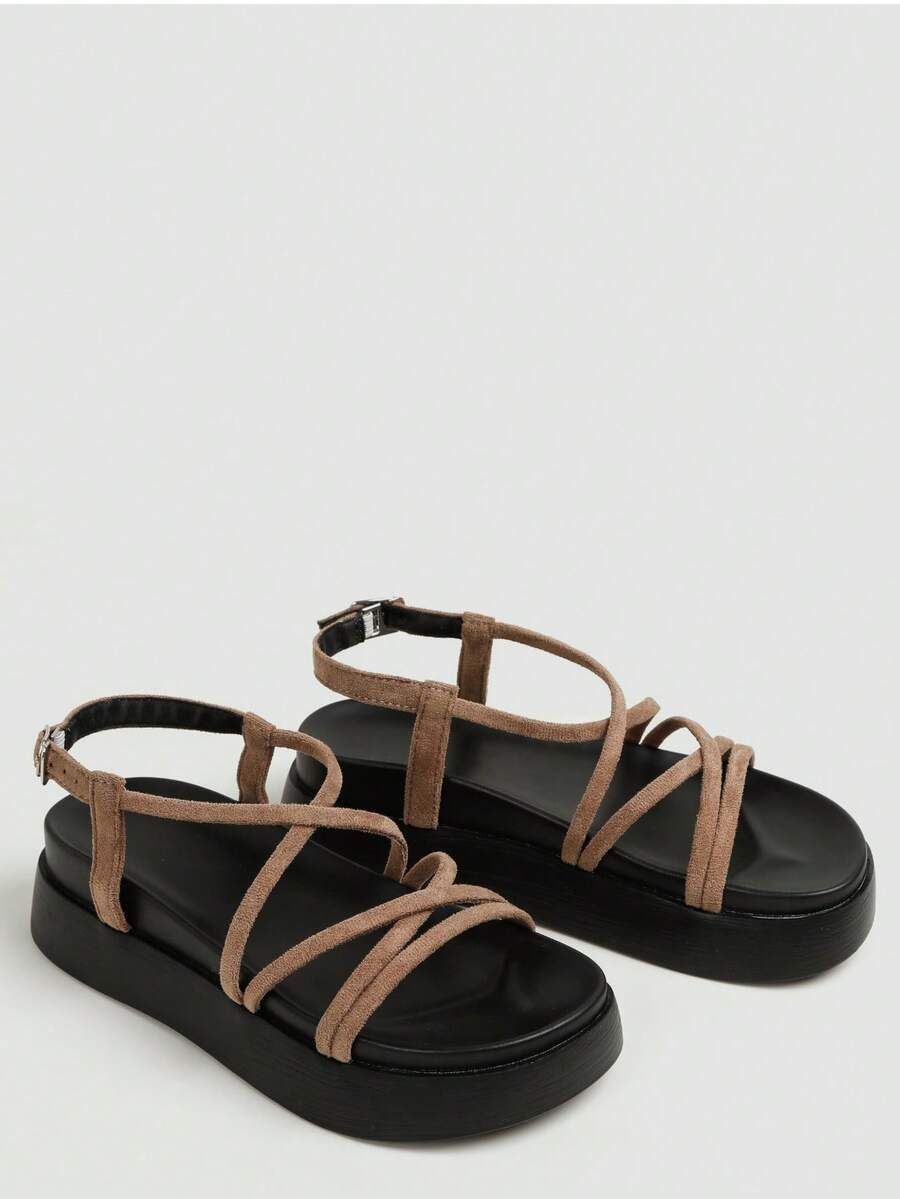 Tan suede like flatform sandals studio view with crisscross straps and black sole