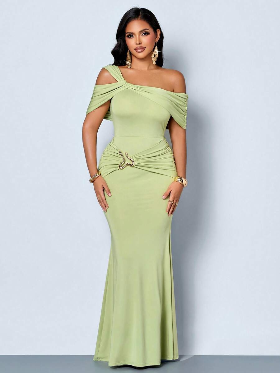 Front view of sage green asymmetric cold-shoulder mermaid maxi dress with gold-tone hip accent