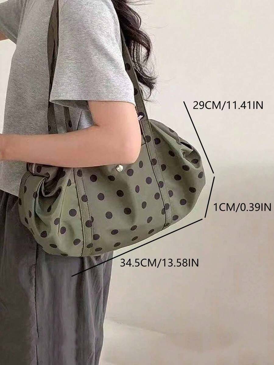 Olive green black polka dot shoulder tote bag on model with size labels showing 34.5 cm length and 29 cm height