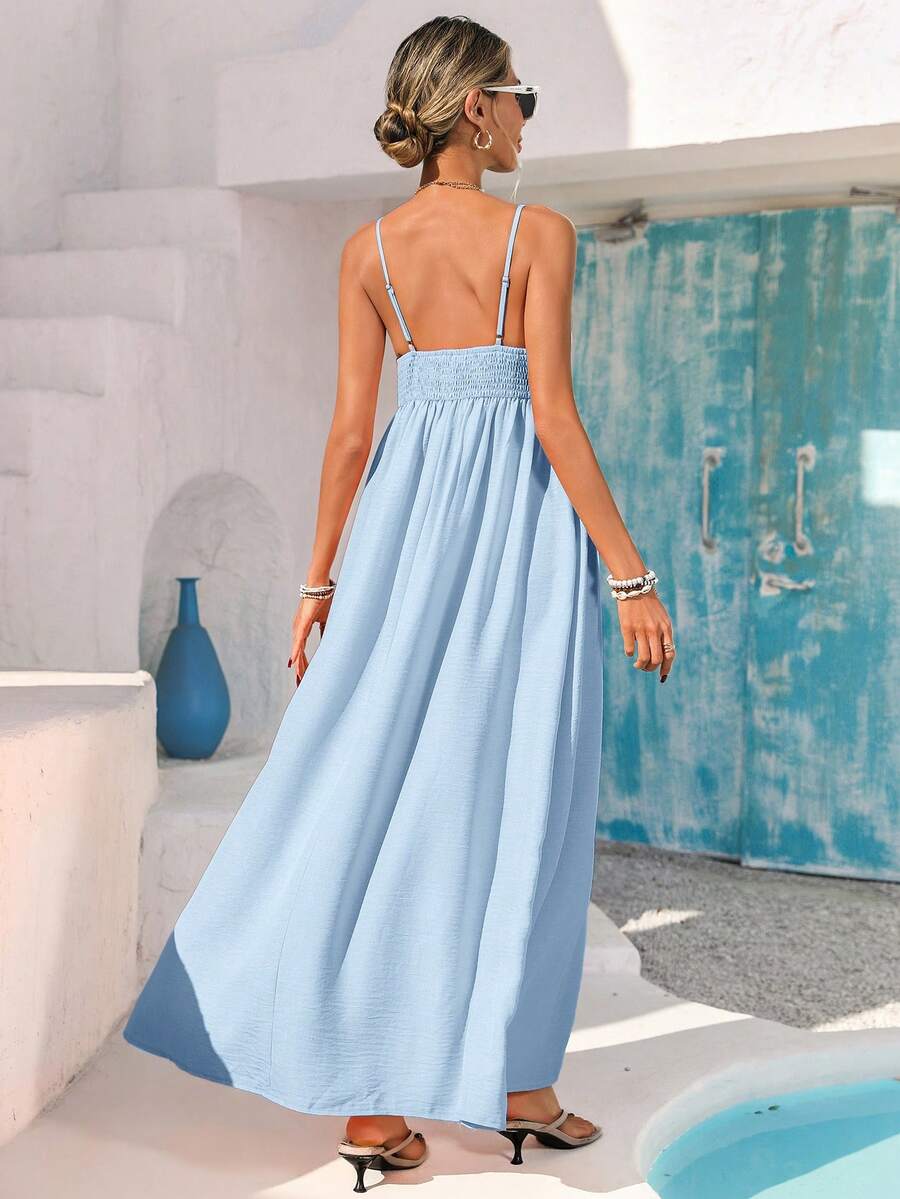 Light blue ruffle-front spaghetti strap maxi sundress by pool with white flowers