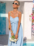 Back view light blue smocked-back spaghetti strap maxi sundress near pool door