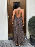 Capture effortless elegance with this blue plaid halter maxi dress, designed to blend classic charm with modern sophistication.