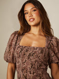 Full front view of brown printed vacation mini dress with square neckline and tiered skirt