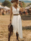 Front view of white lace V neck asymmetrical dress styled with boots in field
