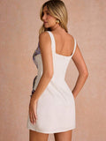 Back view of white fitted mini dress with wide straps and center zipper