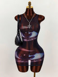 Front view of black mesh bodycon mini dress with large blue eye graphic