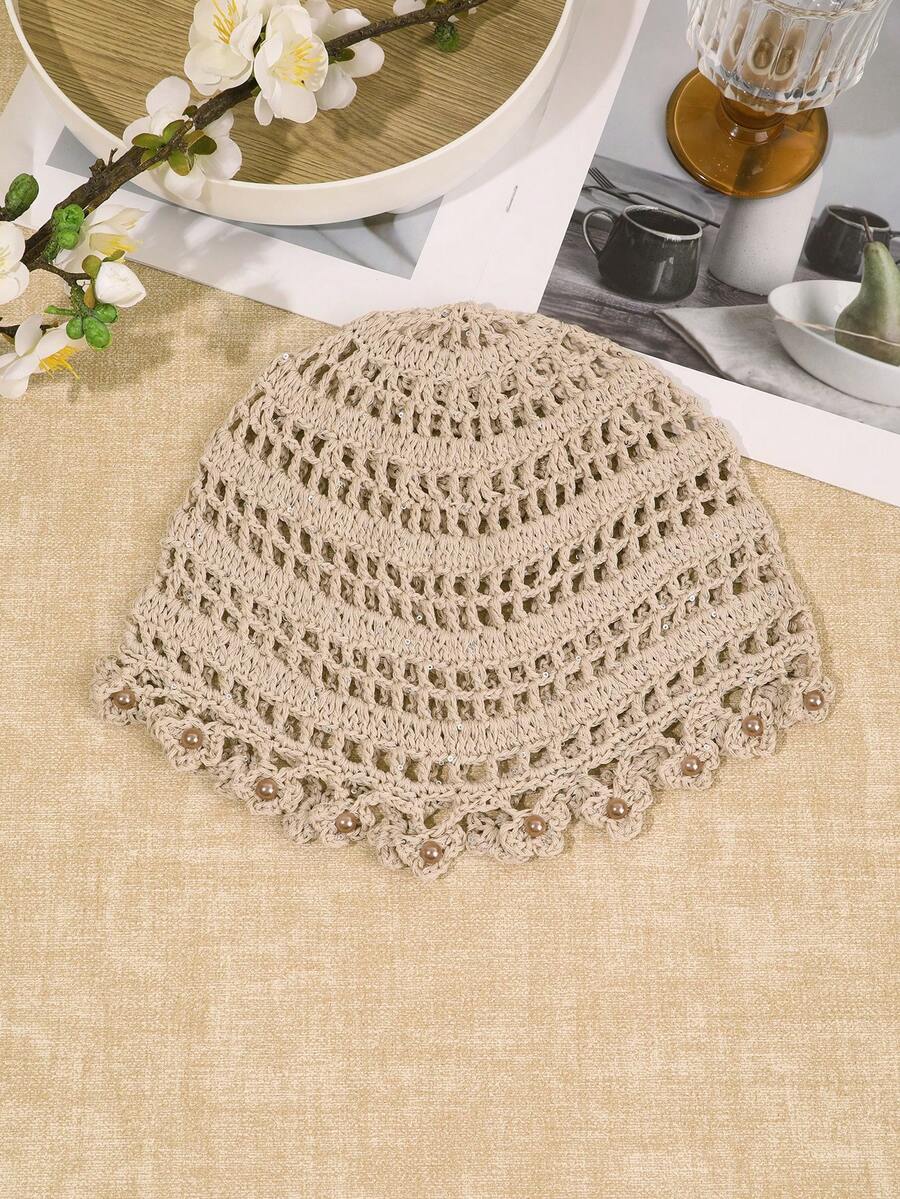 Side view of beige boho floral crochet bucket hat with airy lattice rows