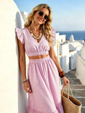 Close front view of pink striped V neck crop top and wide leg pants