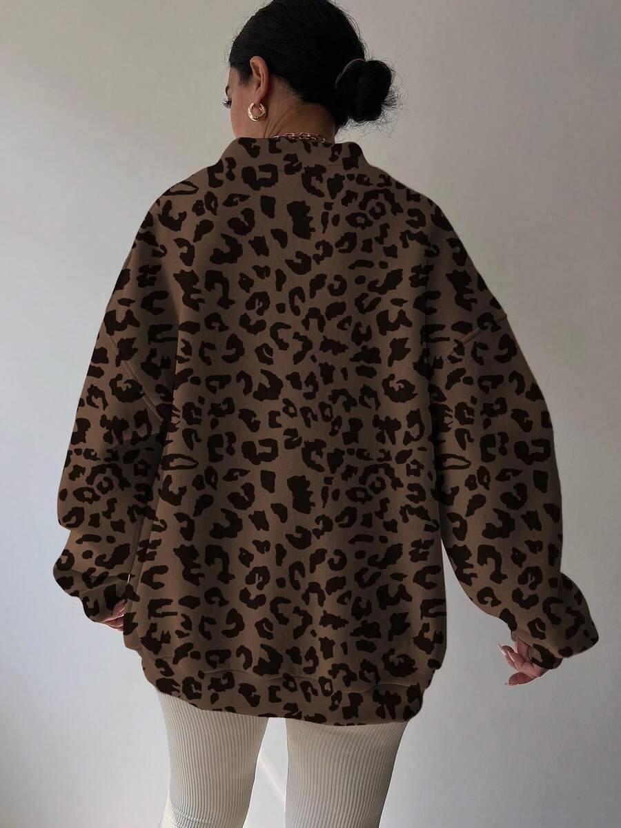 Back view of chocolate brown leopard-print oversized sweatshirt with rib-knit hem