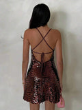 open back sequin cami mini dress with scoop neckline, spaghetti straps, crisscross tie back, fitted bodice, slight A-line mini skirt, iridescent sequin variants and orange floral print variant image 14