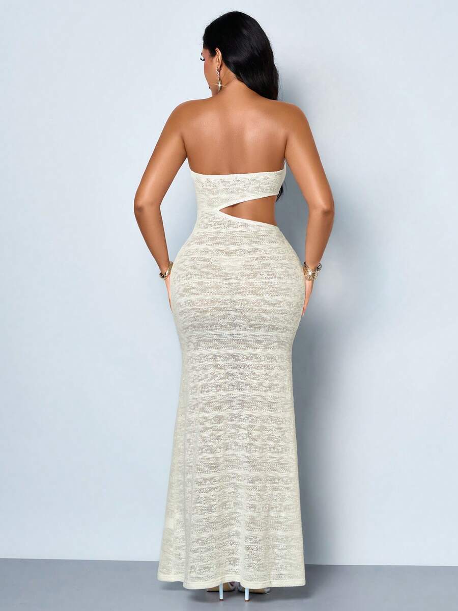 Front view of ivory textured strapless bodycon maxi dress with asymmetric cutouts and metal accents