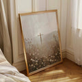 Gold framed Christian cross meadow canvas leaning in a sunlit bedroom