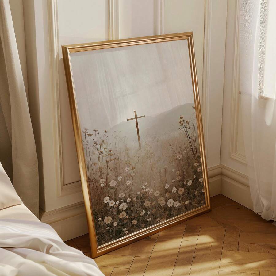 Gold framed Christian cross meadow canvas leaning in a sunlit bedroom