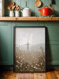 Black framed cross and wildflower meadow canvas against green kitchen cabinets