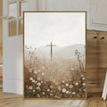 Large wood framed Christian cross wildflower canvas leaning in a neutral room