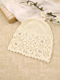 White textured floral mesh crochet beanie with raised appliques