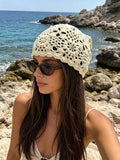 Cream floral crochet beanie cap with open holes and scalloped edge