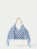 Light blue crochet beach bag front view with hollow weave long tassels and cream bead handle