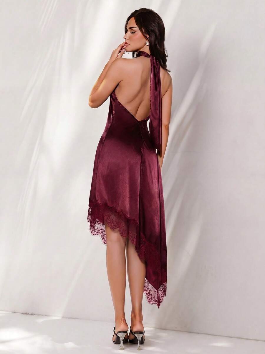 Back view of burgundy satin halter mini dress with open back and long neck ties