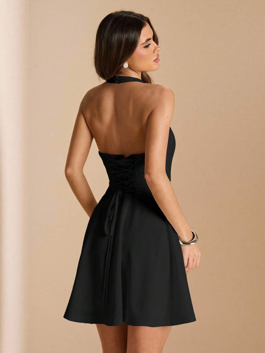 Black corset-back mini dress rear view