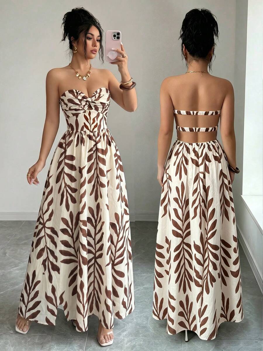 Side view of brown leaf print strapless maxi dress with fitted bodice and flowing vacation skirt