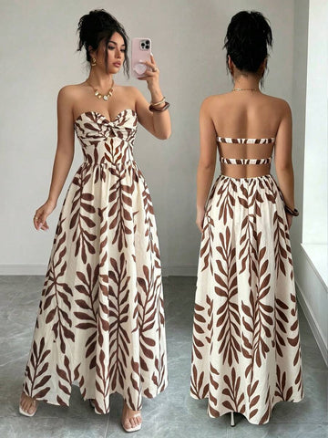 Side view of brown leaf print strapless maxi dress with fitted bodice and flowing vacation skirt