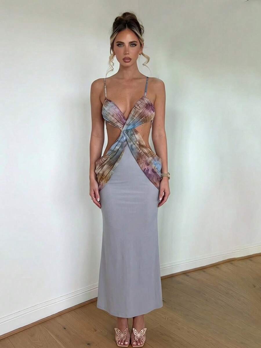 Front view of grey abstract print cutout maxi dress with twist front, spaghetti straps, and fitted skirt