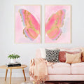 Framed butterfly artwork pair displayed in a living room