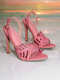 Pair of pink slingback high heel sandals with rhinestone leaf vamp on glossy floor