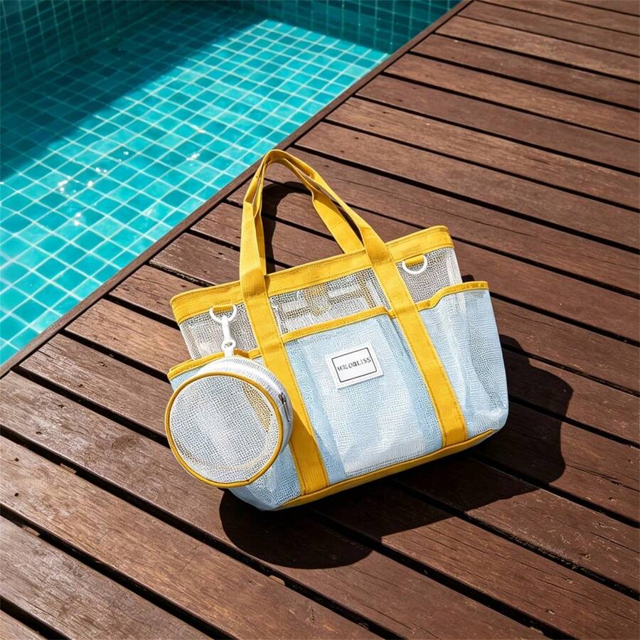Front poolside view of blue mesh beach tote bag with yellow webbing handles