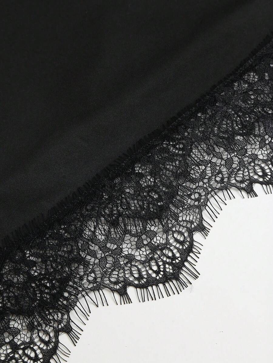 Black fitted party mini dress with scalloped lace edge