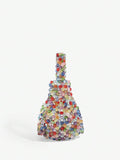 Close view of chunky transparent beads on multicolor mini hobo handbag