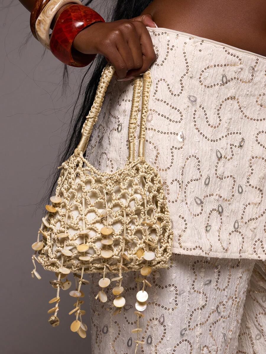 Macrame beach bucket bag with open net texture and wrapped double handles