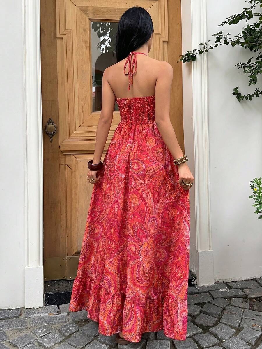 Back view coral pink paisley halter maxi dress with smocked back and ruffle hem