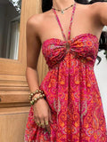 Close-up hot pink paisley halter dress with ruched sweetheart bust and keyhole