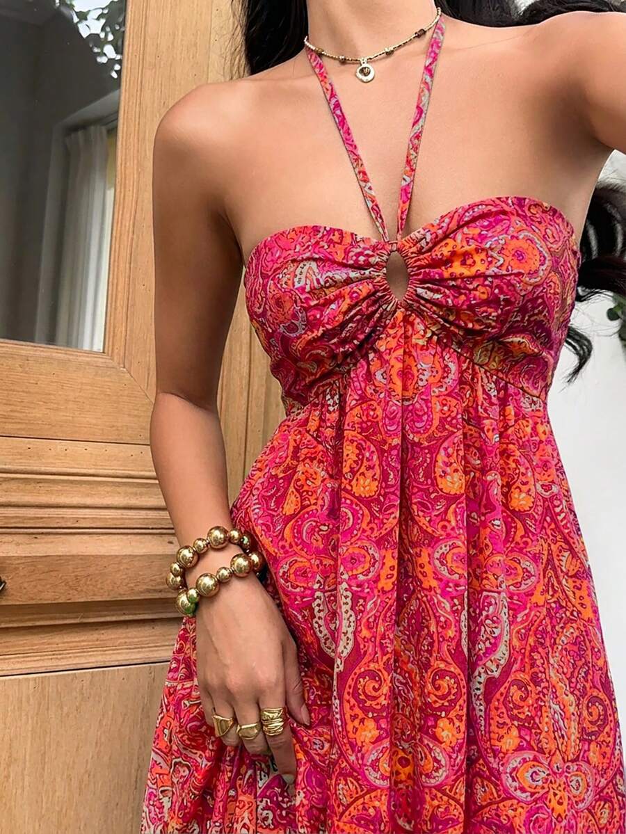 Close-up hot pink paisley halter dress with ruched sweetheart bust and keyhole